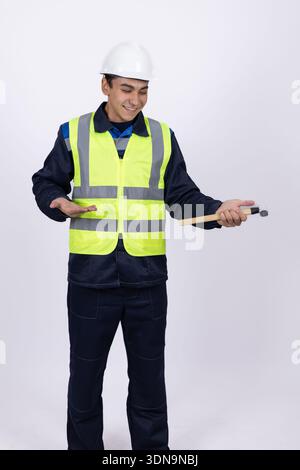 Construction worker gesturing and talking in studio Stock Photo