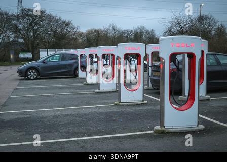Tesla charging points / Tesla Charging stations at South Mimms Services, Hertfordshire, England, UK Stock Photo