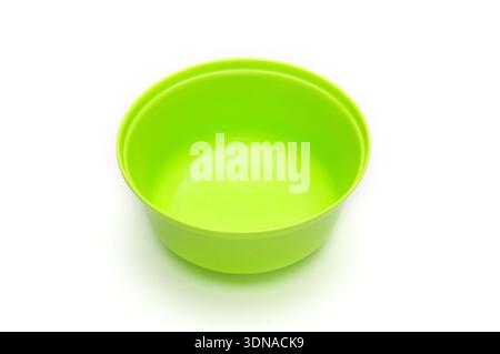 Green bowl for fruits and vegetables on an isolated white background Stock Photo
