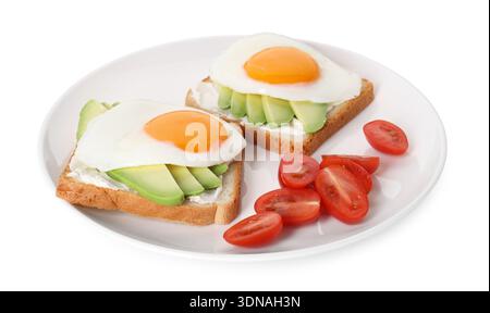Delicious avocado toasts with eggs and tomatoes isolated on white Stock Photo