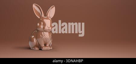 Chocolate Easter bunny on brown background with copy space for text. Stock Photo