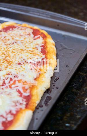 Detail of a homemade pizza on a sheet pan Stock Photo