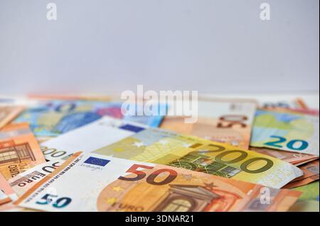 Banknotes of various Euro denominations are spread out for viewing. Stock Photo