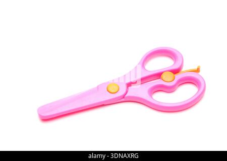 Pink baby scissors on an isolated white background Stock Photo