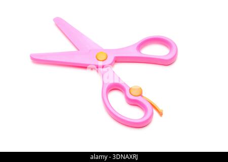 Pink baby scissors on an isolated white background Stock Photo