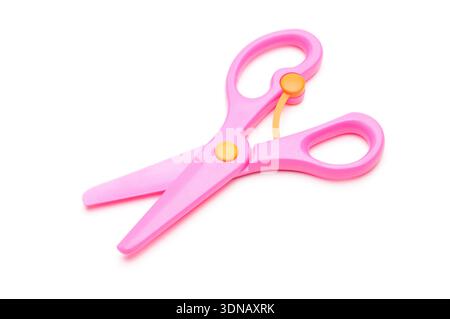 Pink baby scissors on an isolated white background Stock Photo