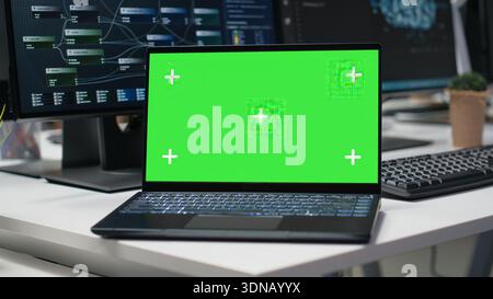 Isolated screen laptop in empty Silicon Valley company office used for developing apps. Mockup notebook using deep learning tech in workplace to debug applications and resolve issues Stock Photo