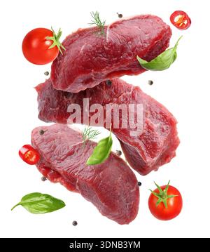 Fresh beef steaks falling on white background Stock Photo