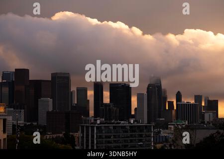 Menacing storm clouds at sunset hovering over the downtown Los Angeles skyline Stock Photo
