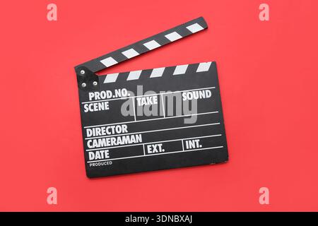 Movie clapper on red background Stock Photo
