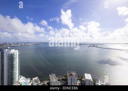 Aerial view of a vibrant seascape where the deep blue waters meet the horizon, framed by the skyline and bridges, Key Biscayne, Florida, United States Stock Photo