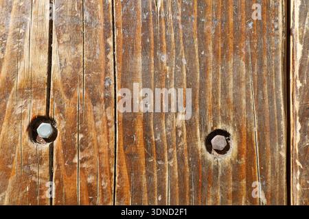 Horizontal texture photo of old timber with visible bolts, great for DIY, construction, or natural material design themes. Stock Photo