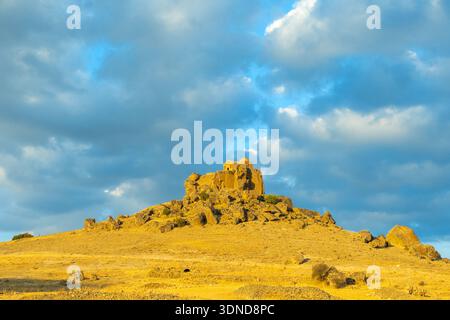 Turkey, Central Anatolia, Aksaray province, Cappadocia, Guzelyurt, motorcyclist in front of the village Stock Photo