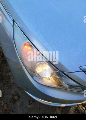 the front headlight of the car covered with frost Stock Photo - Alamy