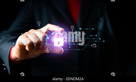 Concept cybersecurity and data privacy for secure access and encryption, businessman pinching glowing padlock icon with digital circuit network lines Stock Photo
