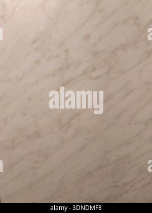 Muted cream and beige marble texture creating a subtle backdrop with diagonal veins, perfect for elegant design elements and architectural backgrounds Stock Photo