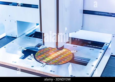 Silicon wafer with semiconductor microchip on machine process examining testing in microscope. Stock Photo