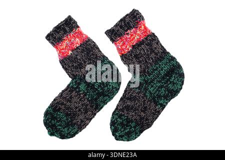 Knitted wool, handmade socks on a white background Stock Photo