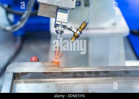 Welding robot arm in production factory Stock Photo