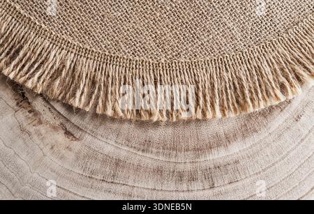 Hessian sackcloth burlap woven texture on wooden background Stock Photo