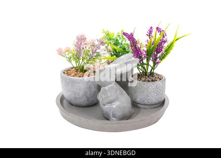 Easter decoration:concrete tray and concrete decorative bunny figure with flower in pot Stock Photo