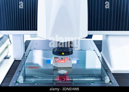 Vision measuring instrument inspecting PCB circuit board Stock Photo