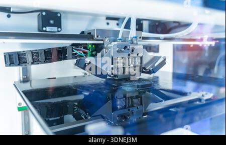 3D printer or additive manufacturing and robotic automation technology. Stock Photo
