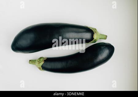 Two eggplants on a white background. High quality photo Stock Photo