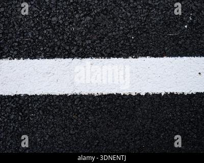 a white line on a tarmac road Stock Photo
