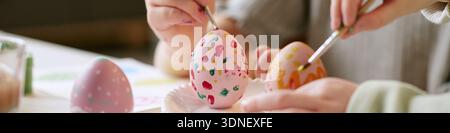 Header of Children Decorating Easter Eggs Together during Creative Activity Stock Photo