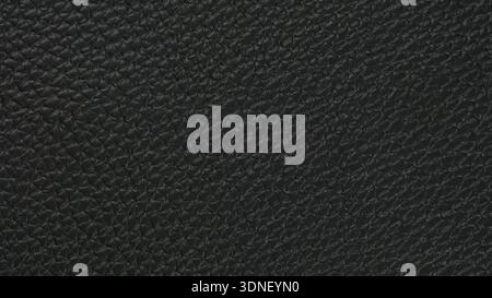 Textured elegance of black leather showcasing intricate patterns and rich depth in soft and luxurious material Stock Photo