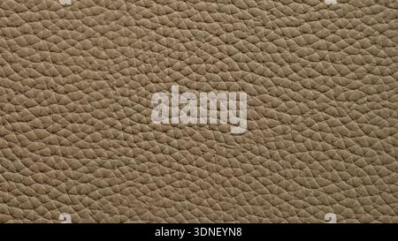 Textured beige leather background showcases intricate patterns and subtle depth, inviting tactile exploration and visual intrigue Stock Photo