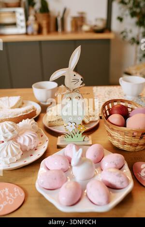 Easter Table Displaying Painted Eggs and Pastries during Spring Celebration Stock Photo