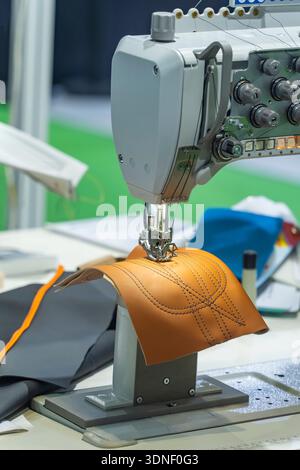 Close up of tanned leather sewn using a sewing machine Stock Photo