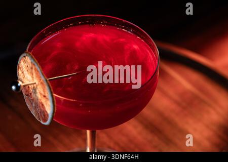 Beautiful texture on a cosmopolitan using reg edible glitter and and a dehydrated lime wheel Stock Photo