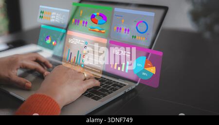Close up of businesswoman hands using laptop with digital financial charts and data analysis dashboard icons, virtual screen, business intelligence, a Stock Photo