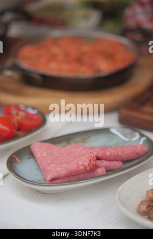 Food preparation with various dishes in the kitchen setting Stock Photo