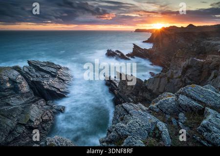 Sunset over the dramatic coastline of Anglesey, North Wales, UK. Stock Photo