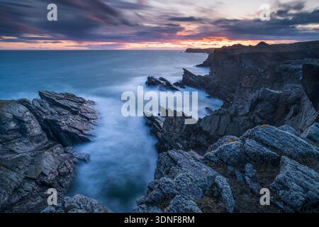 Sunset over the dramatic coastline of Anglesey, North Wales, UK. Stock Photo