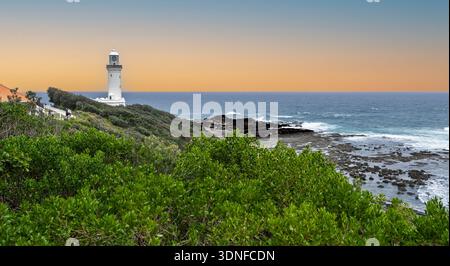 Panoramic view of Norah Head Lighthouse and the ancient rock platform abutting the Pacific Ocean at Norah Head, NSW, Australia on 11 January 2026 Stock Photo