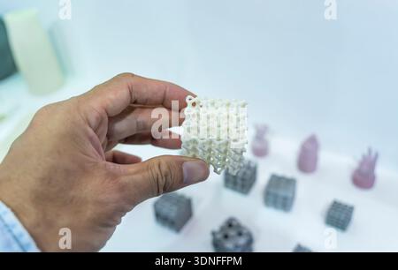 hand with Object printed on 3d printer close-up. Stock Photo