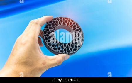 hand with Object printed on 3d printer close-up Stock Photo