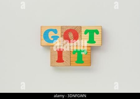 Colorful wooden blocks spelling GOT IT Stock Photo