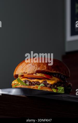 Burger on a dark background isolated with space for text Stock Photo
