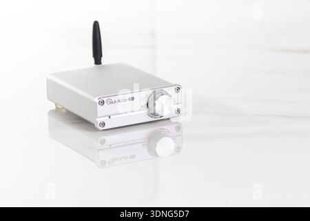 VINKOVCI, CROATIA, 01.16.2021:Modern compact audio amplifier with metallic finish and antenna, suitable for electronics representation and tech concep Stock Photo