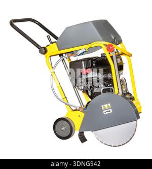 A bright yellow concrete cutter stands poised for work at a construction site. This robust machine, equipped with a strong engine, is set to smooth an Stock Photo