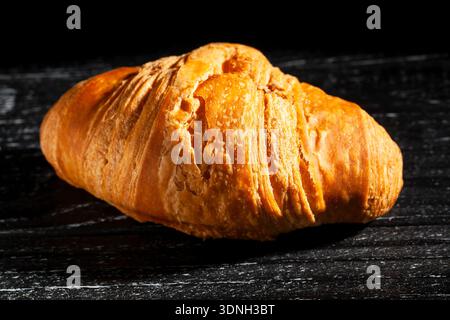 croissant on wood black background Stock Photo