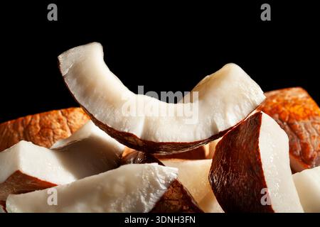 sliced coconut on black background Stock Photo