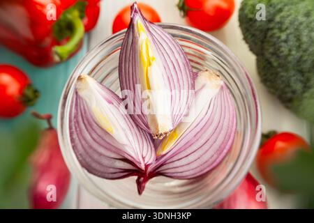 sliced red onion on wood background Stock Photo