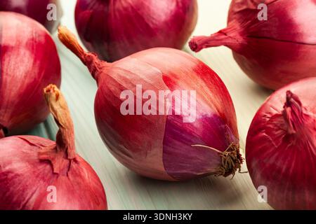 red onion on wood background Stock Photo